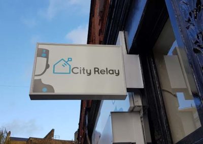 Illuminated Projecting Sign for City Relay
