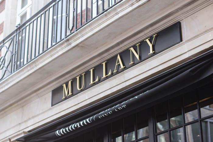 Elevated brass fascia signage for Mullany