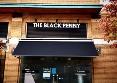 Exterior signage for The Black Penny