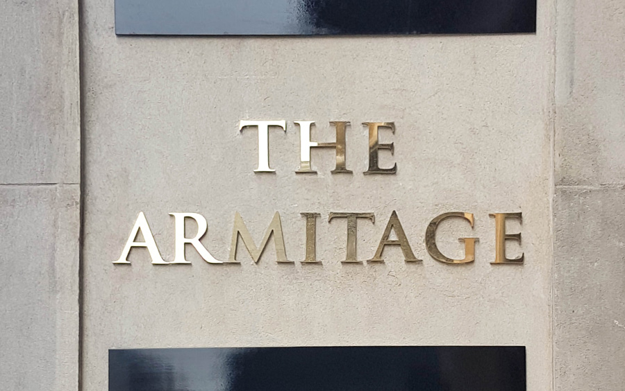 Reverse-etched brass fascia signage for The Armitage