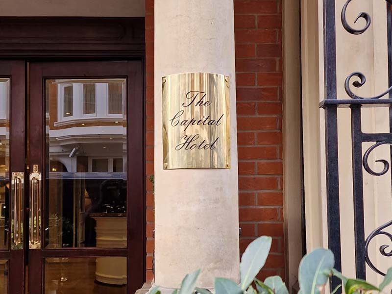 Polished brass Plaque rounded on a column for Capital Hotel in London