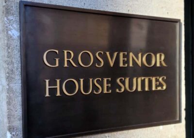 Bespoke Toned Bronze Plaque with laser cut brass lettering – Grosvenor House Apartments